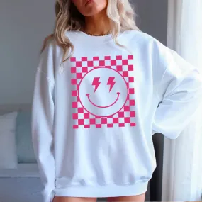 Pink Checkered Smiles: Elevate Your Look with our Smiley Face Graphic Tee